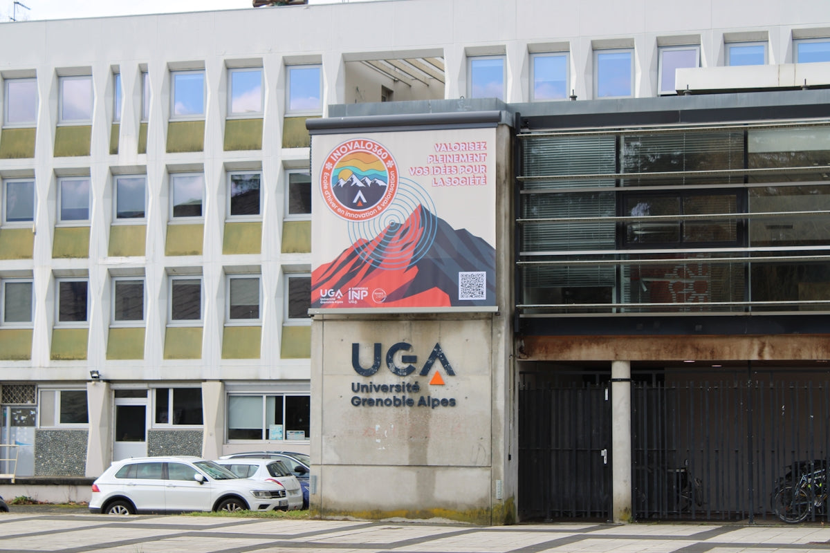 Modern building displaying uga sign and mountain banner