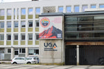Modern building displaying uga sign and mountain banner